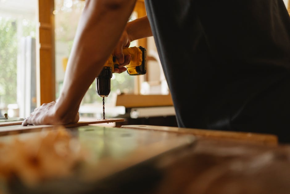 Carpenter carefully installing a new door frame